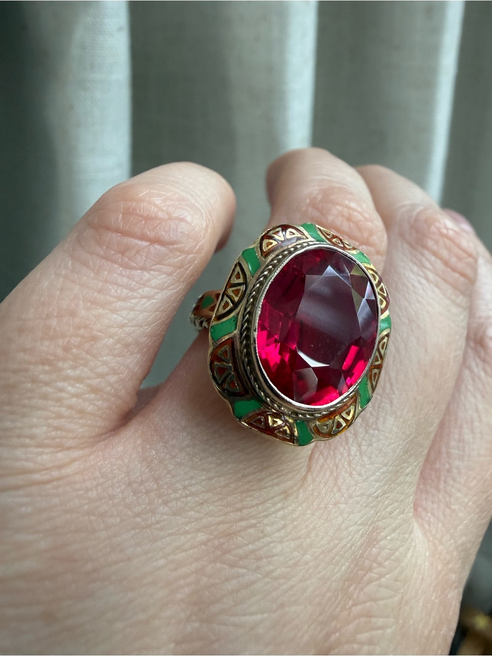 Vintage large costume ring with large red stone and enamel and gold setting